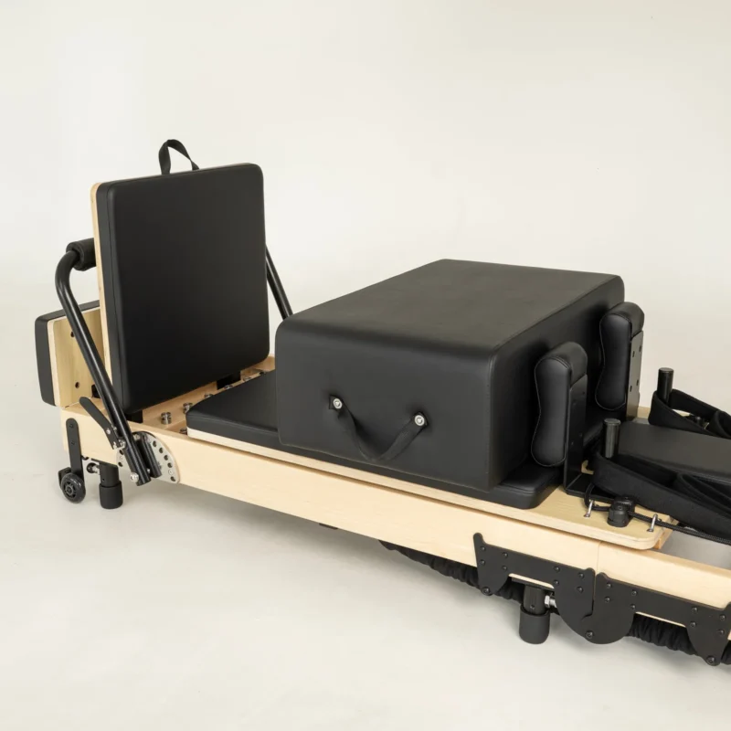 FOLD Reformer Pilates bed in Maple and Black PU leather accessories