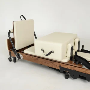 FOLD Reformer Pilates bed in Red Oak and Beige PU leather accessories