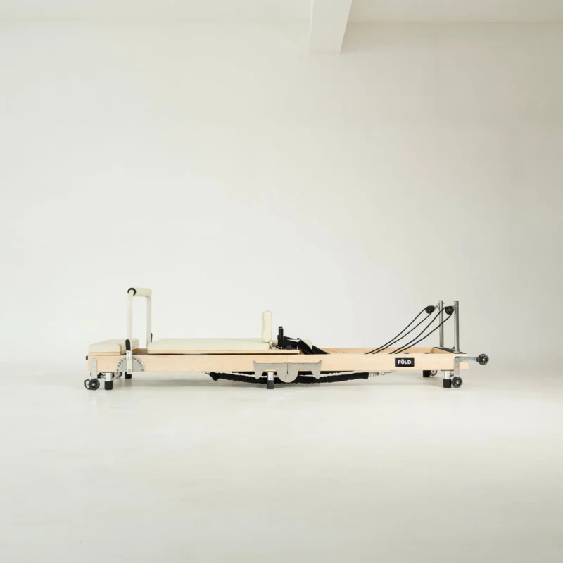FOLD Reformer Pilates bed in Maple and Beige PU leather