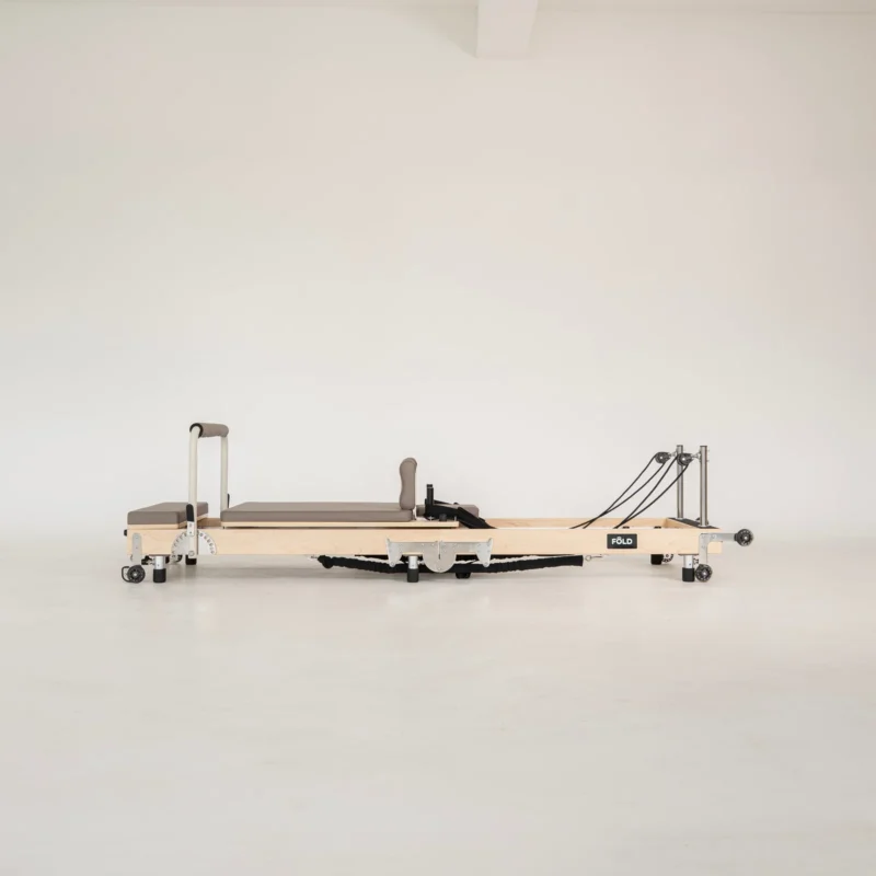 FOLD Reformer Pilates bed in Maple and Mocha PU leather