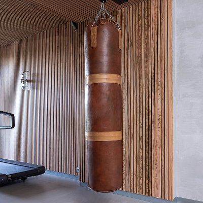 Leather boxing bag in home gym